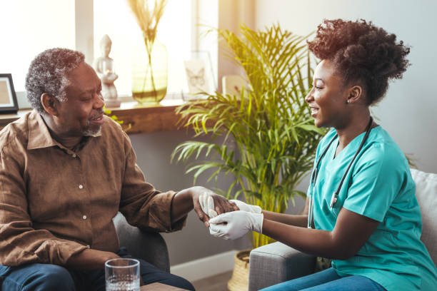 istockphoto-1372116776-612x612 Closeup of a support hands. Closeup shot of a young woman holding a senior man's hands in comfort. Female carer holding hands of senior man