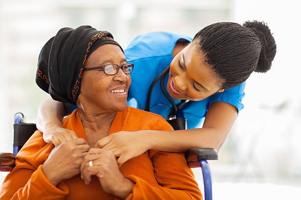 happy senior patient with friendly female nurse happy senior patient with friendly female nurse